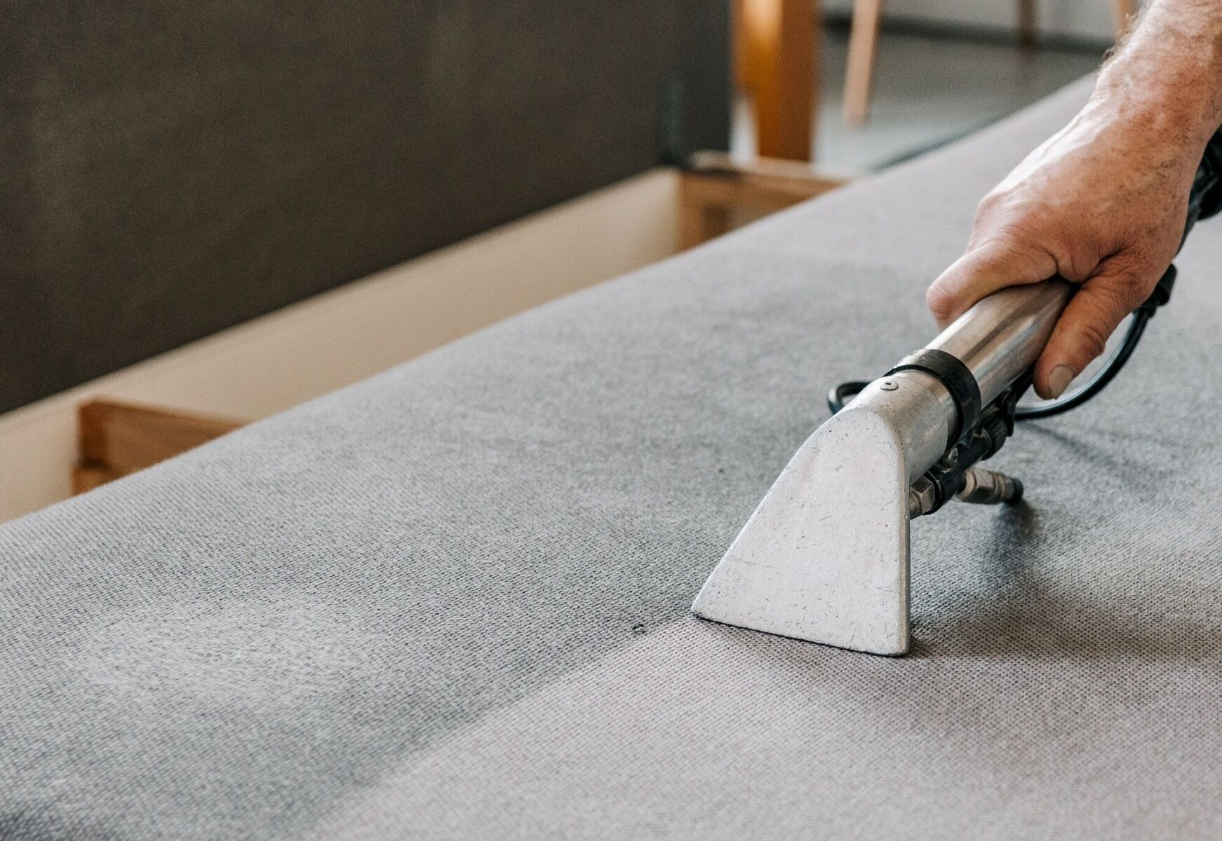 Professional cleaning service deep cleaning sofa at home.